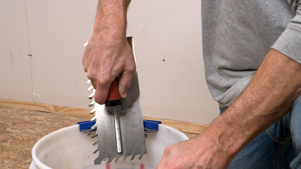 scraping material off the trowel